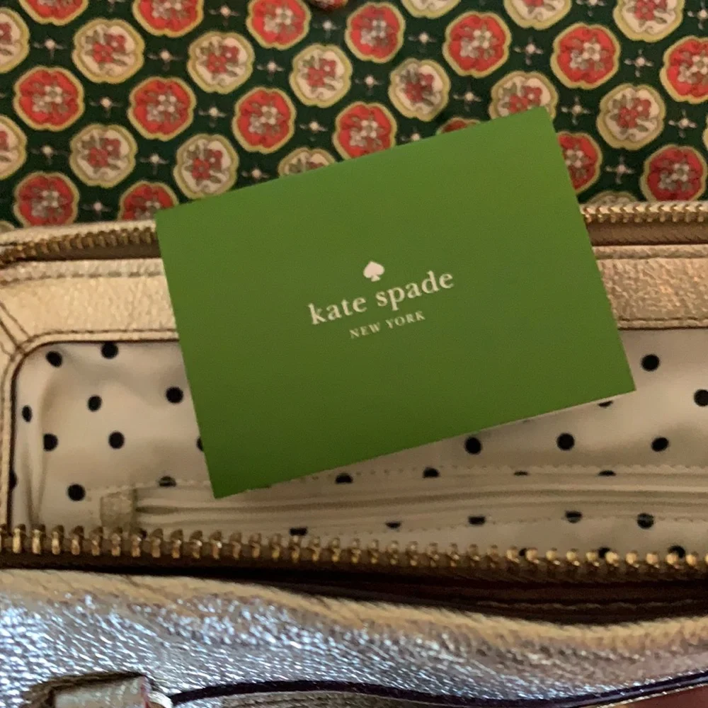 Kate spade gold‎ metallic bow purse. Never used. Retail 298